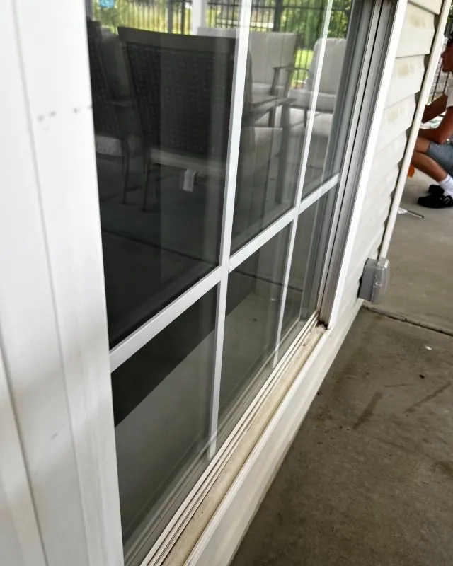 Cleaned sliding glass door and wiped sill on a covered patio, O'Fallon
